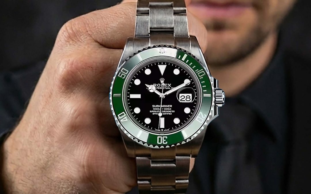 The freelance creative director Christopher Gey from Leipzig holds a Rolex in his hands.
